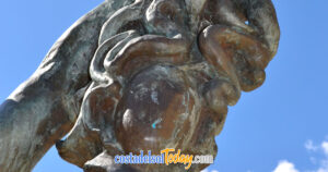 The head of Medusa, held by Perseus, bronze statue by Salvador Dali on the Avenida del Mar in Marbella, Spain - One of ten spectacular Dali sculptures